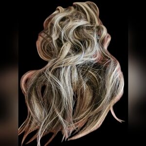 Wavy brown extensions with highlights